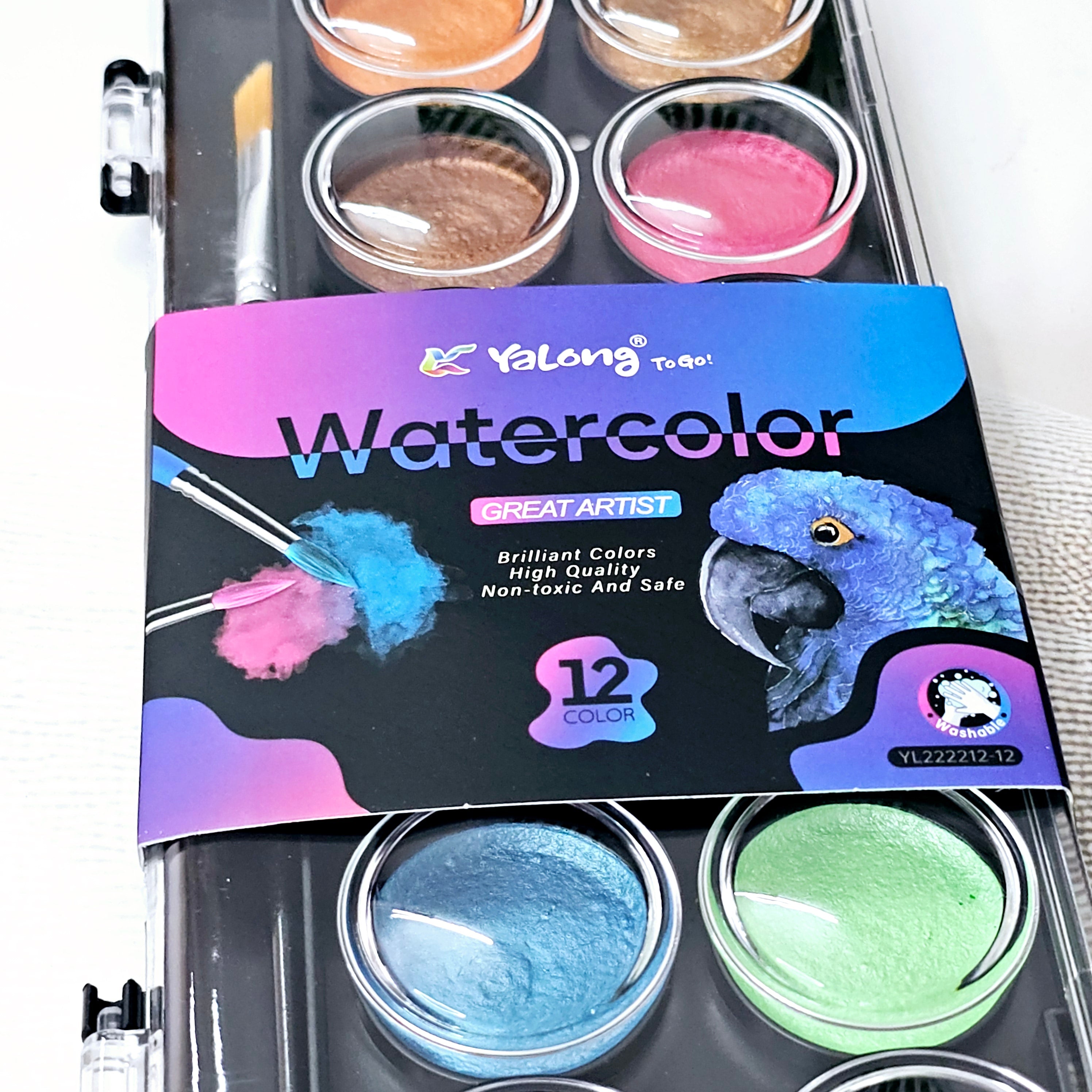 12 Color Metallic Watercolor Paint Set with a brush in a clear case, perfect for kids' art projects. www.usmile.toys